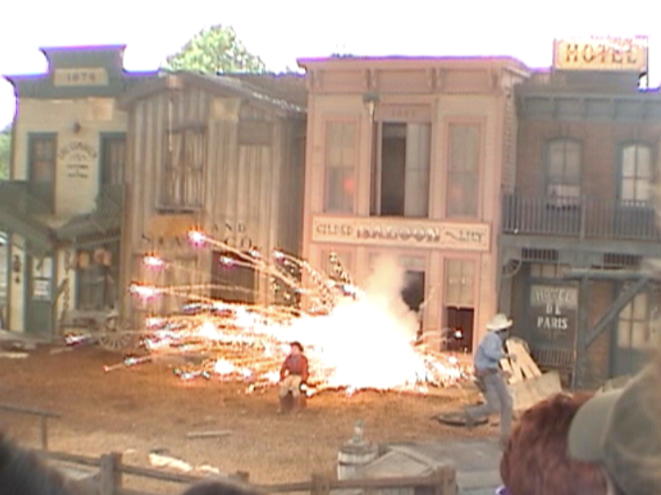 Wild Wild Wild West Stunt Show at Universal Studios Florida, with a large pyrotechnic explosion erupting in front of the western town set.